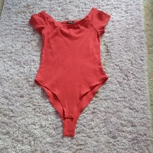 A red bodysuit